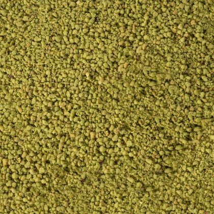 Plano aproximado de uma textura de pó amarelo-esverdeado, grosseira e granulada, a cobrir todo o enquadramento.