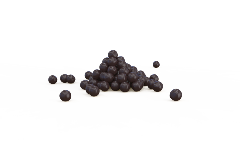 Pequeno monte de pellets redondos roxo-escuro sobre fundo branco, com alguns dispersos em separado