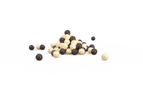 Monte de esferas cor de creme e castanho-escuro, com algumas espalhadas, em fundo branco.